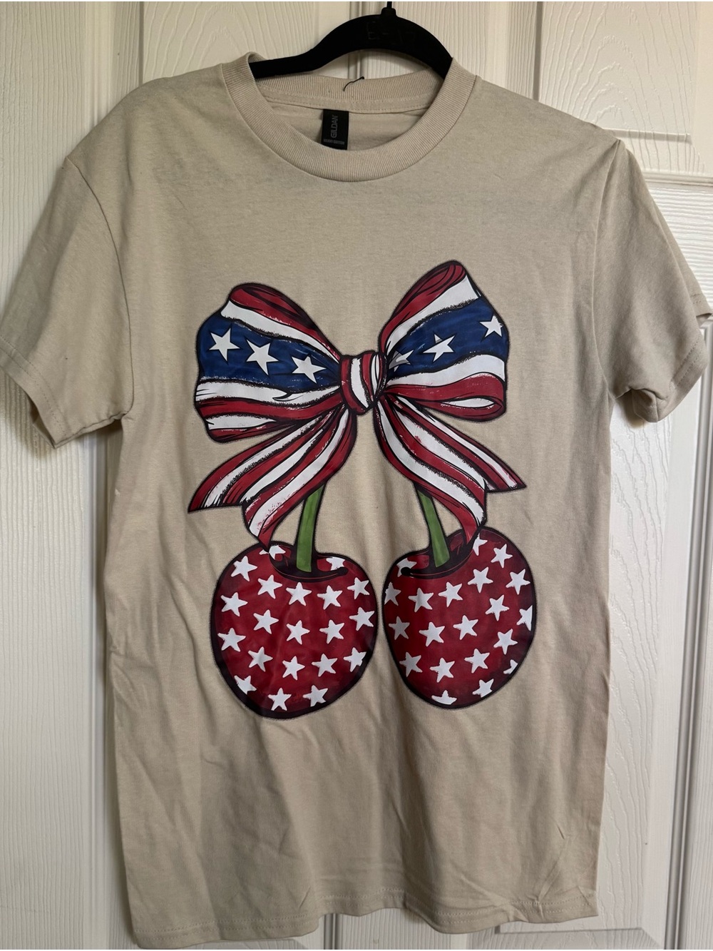 NWOT Women’s Graphic Tee with Patriotic Cherry Bow - Beige, Various Sizes